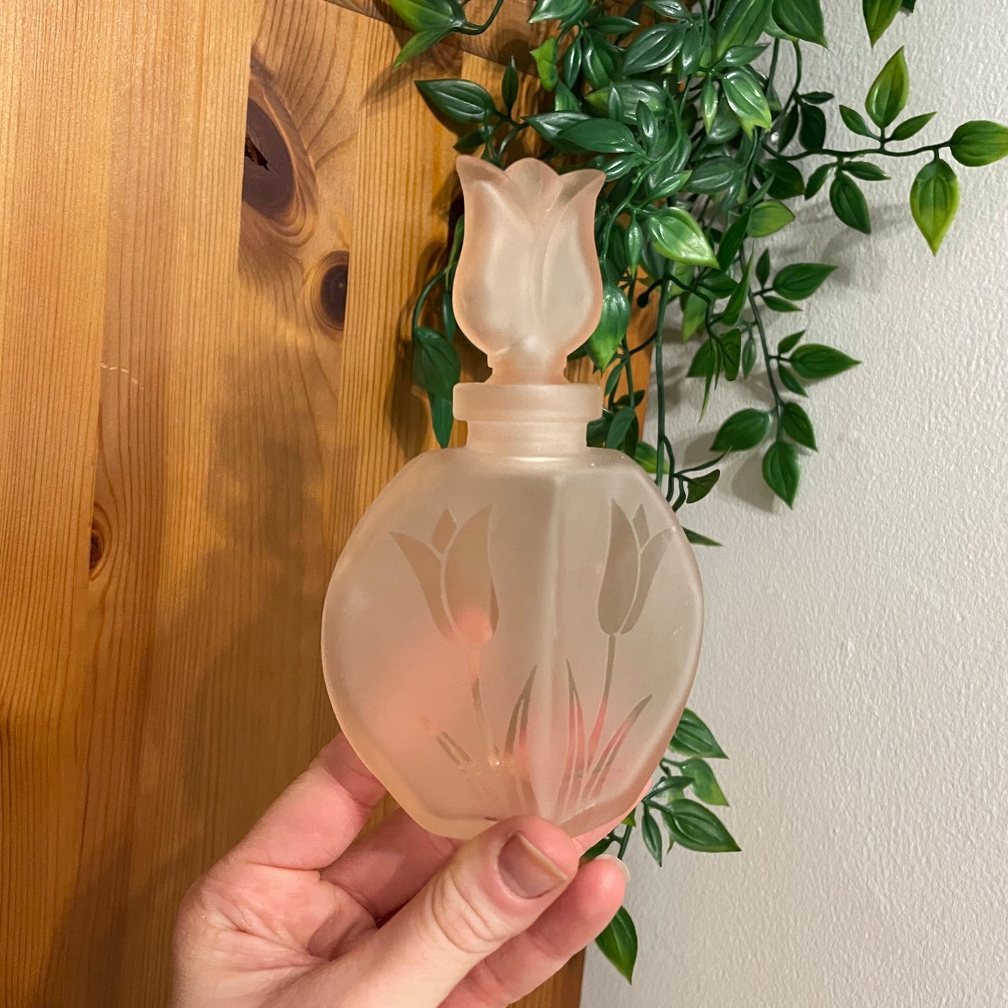 Frosted pink perfume bottle
